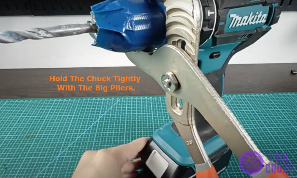 hold the chuck tightly with the big pliers