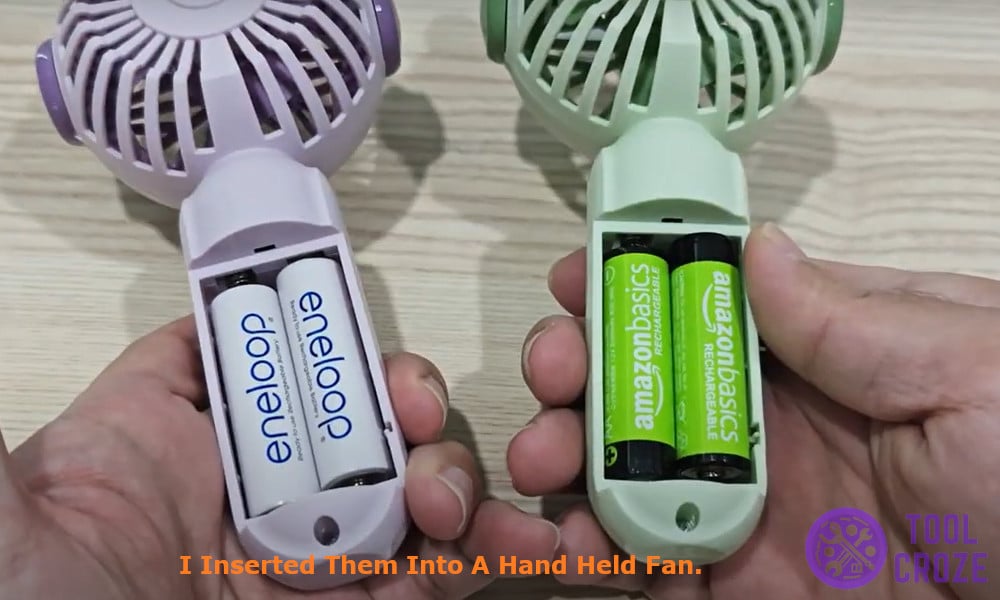 inserting them into a hand held fan