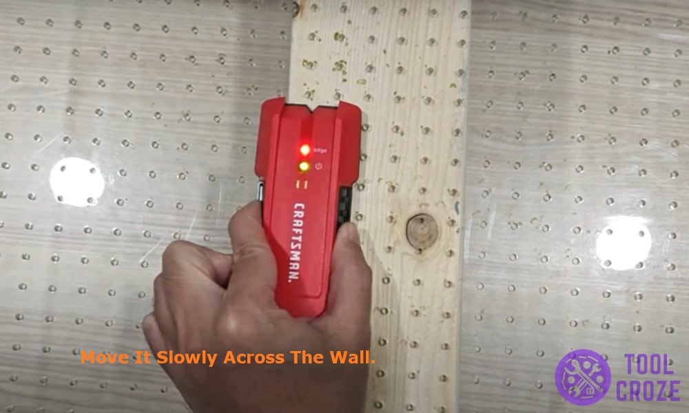 move it slowly across the wall