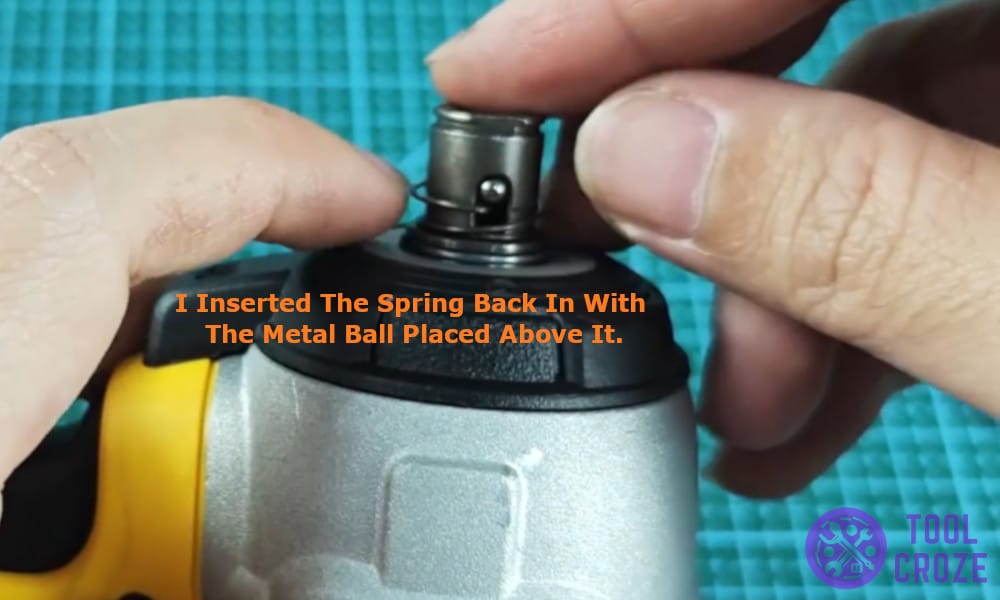 I inserted the spring back in with the metal ball placed above it.