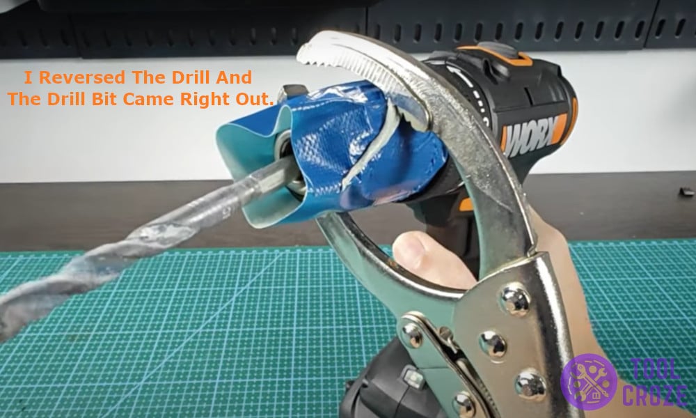 I reversed the drill and the drill bit came right out.