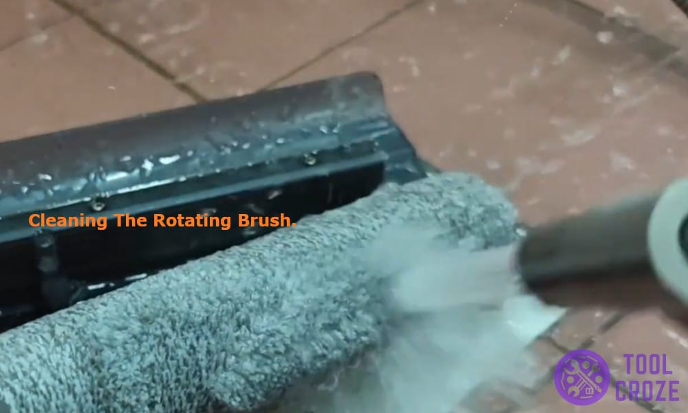 cleaning the rotating brush.
