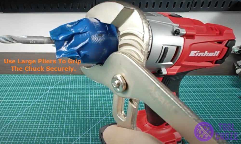 use large pliers to grip the chuck securely