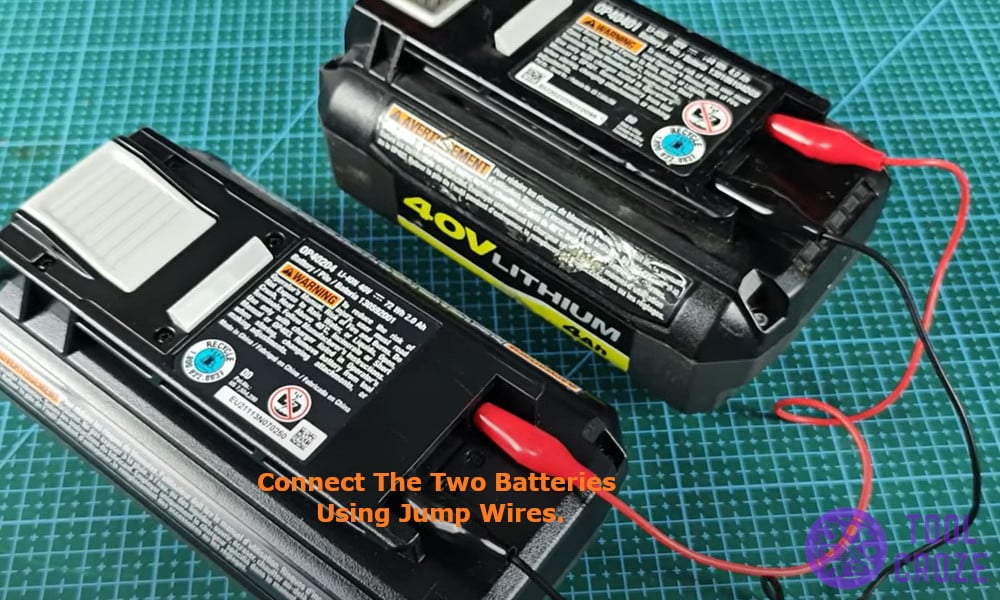 Connect the two batteries using jump wires