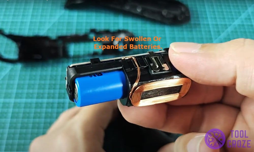 look for swollen or expanded batteries