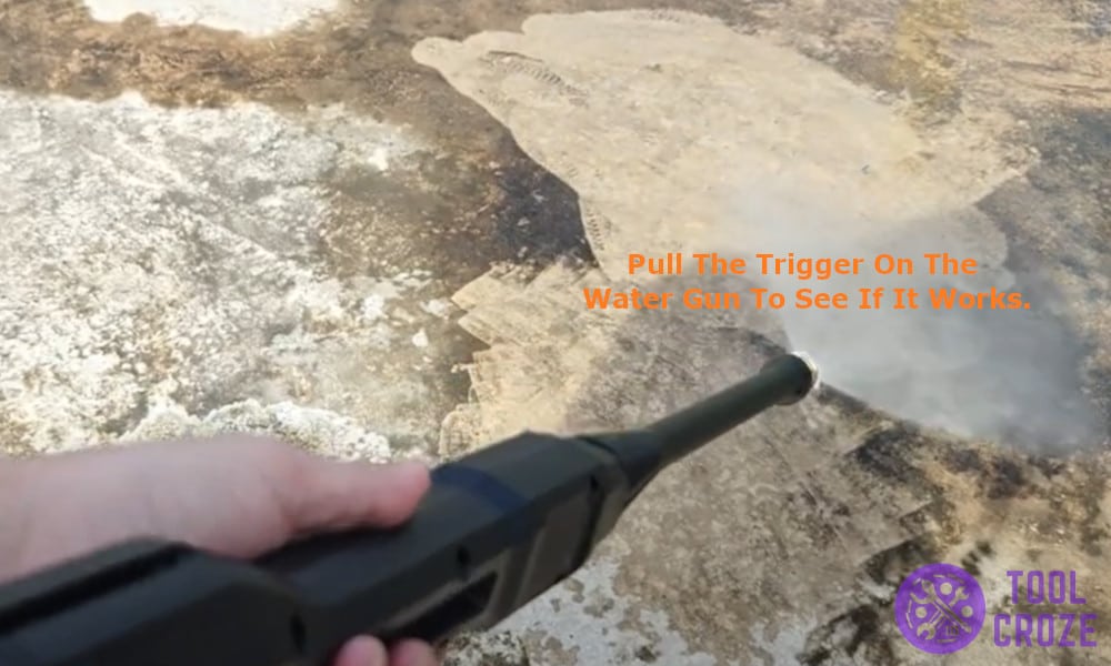pull the trigger on the water gun to see if it works