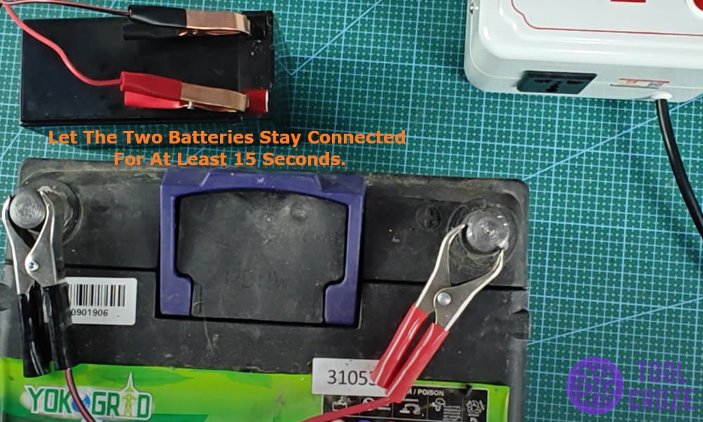 the two batteries connected for at least 15 seconds