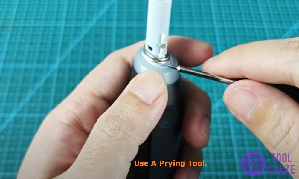 use a prying tool
