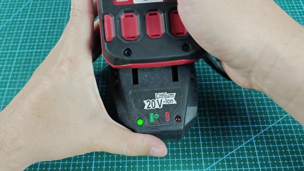 20V lithium battery on charger with green light