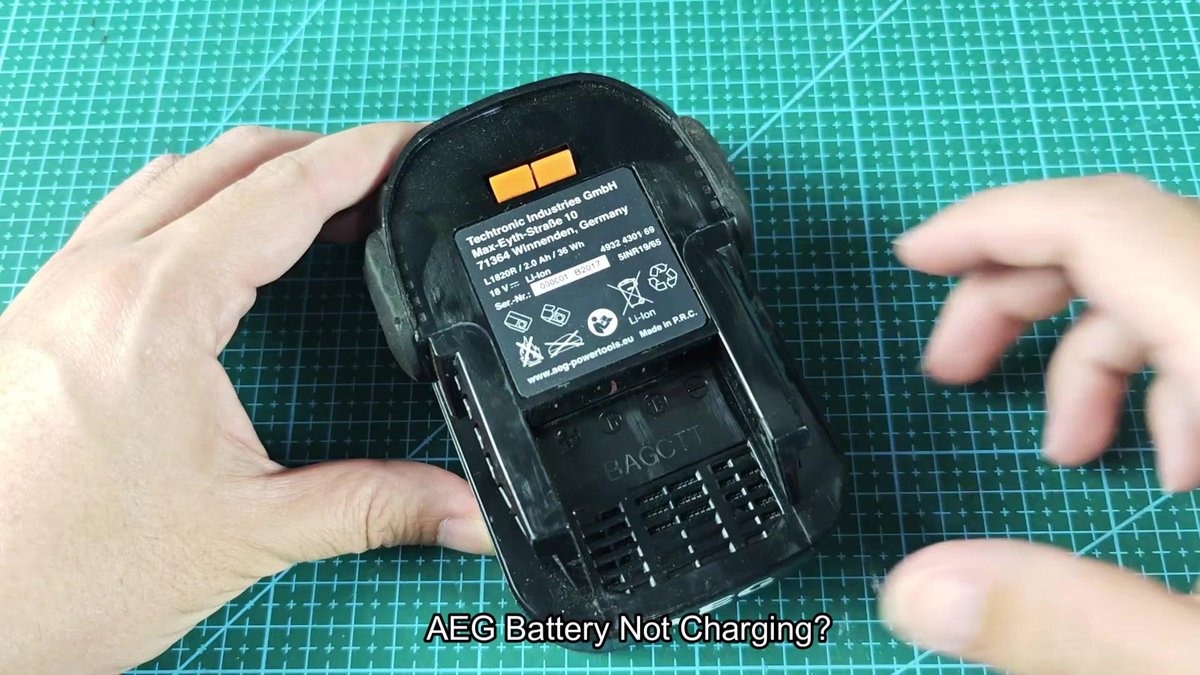 AEG battery on cutting mat with labels visible