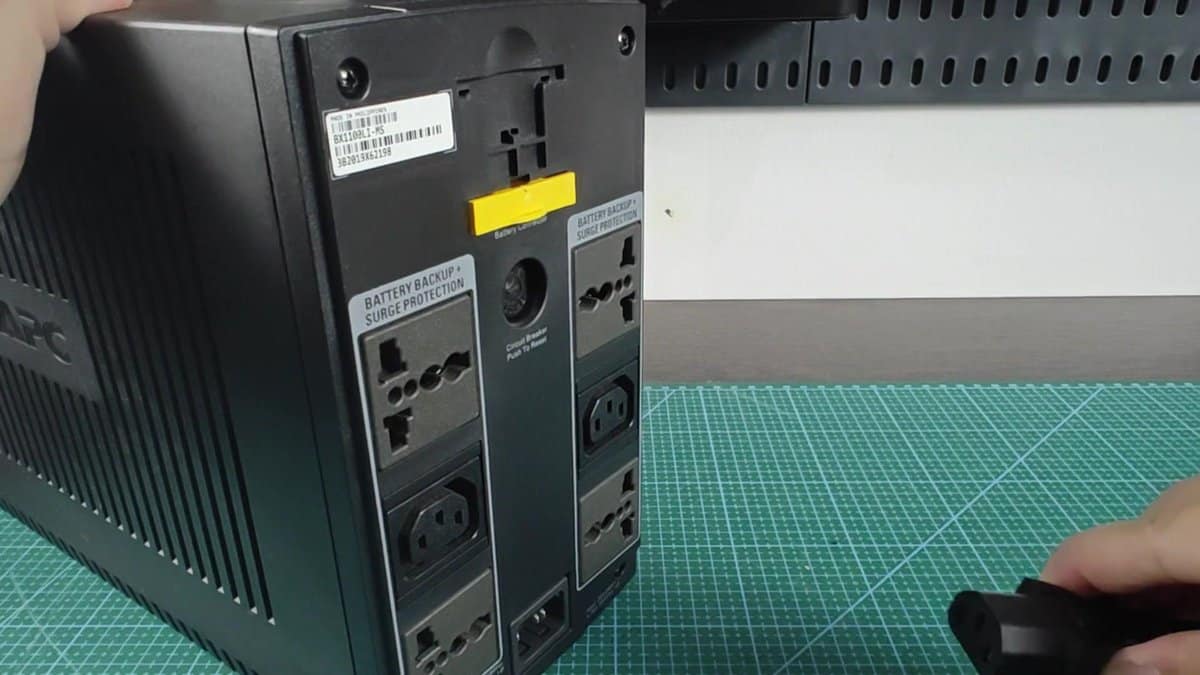 APC battery backup unit on green cutting mat