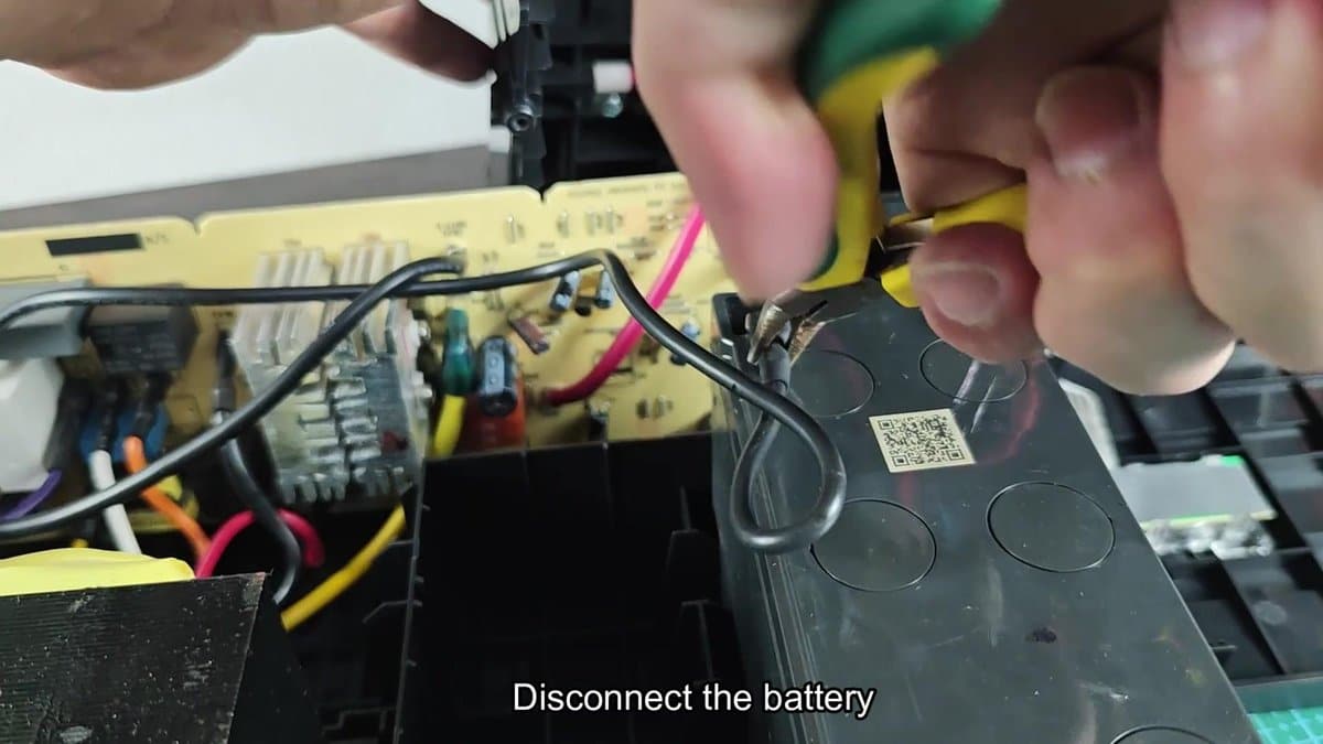 Battery being disconnected with wire cutters
