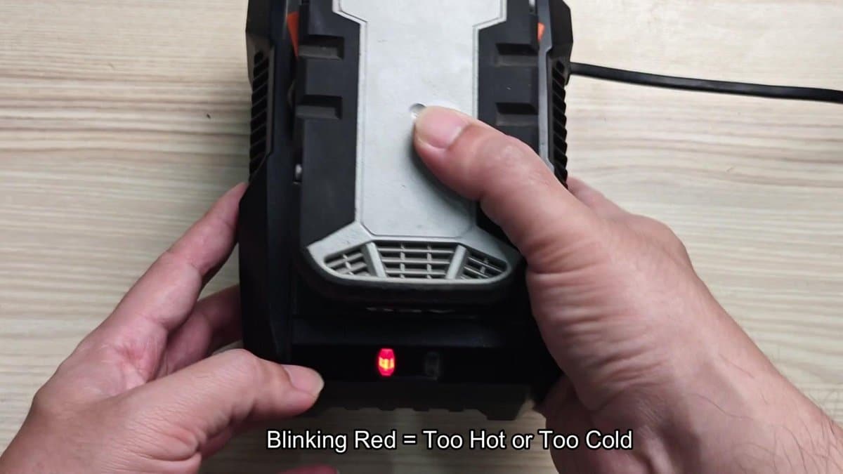 Battery charger with blinking red light indicator