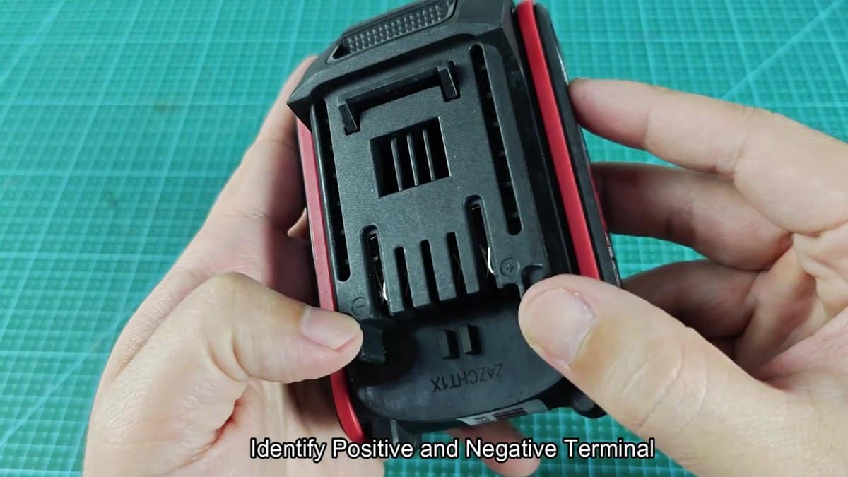 Battery pack underside showing terminal markings