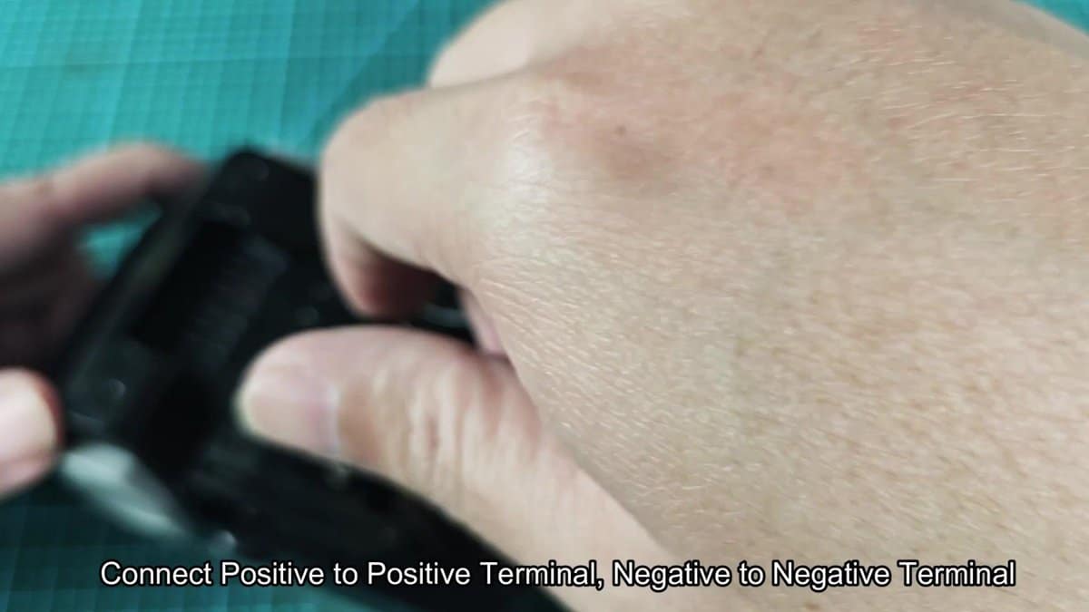 Battery terminal connection being adjusted