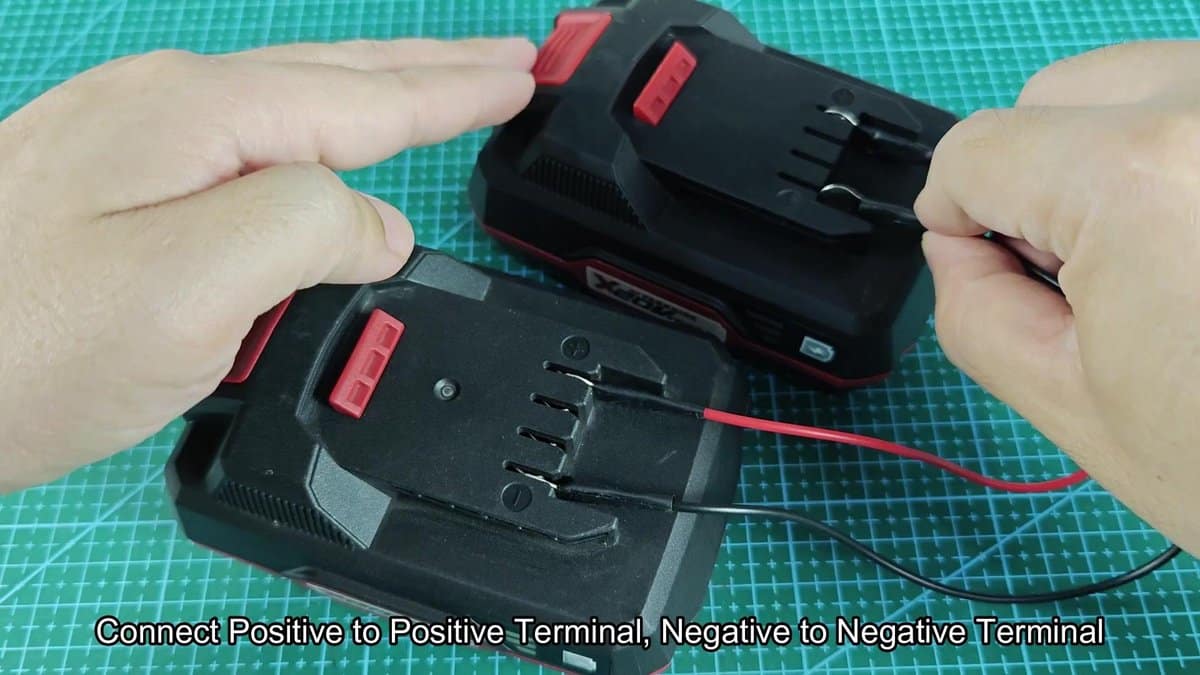 Battery terminals with red and black wires connected