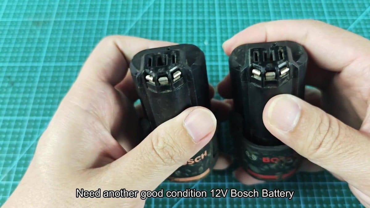 Bosch 12V battery packs on green grid mat