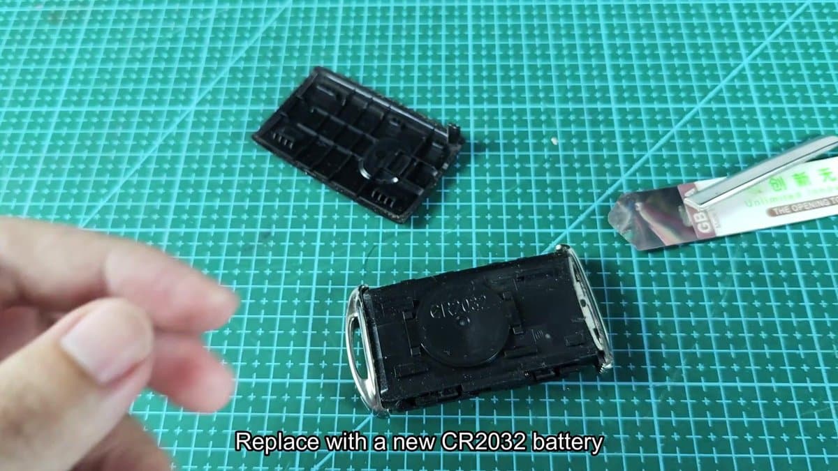 CR2032 battery holder on green cutting mat