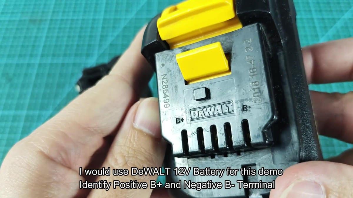 DeWalt 12V battery showing positive and negative terminals
