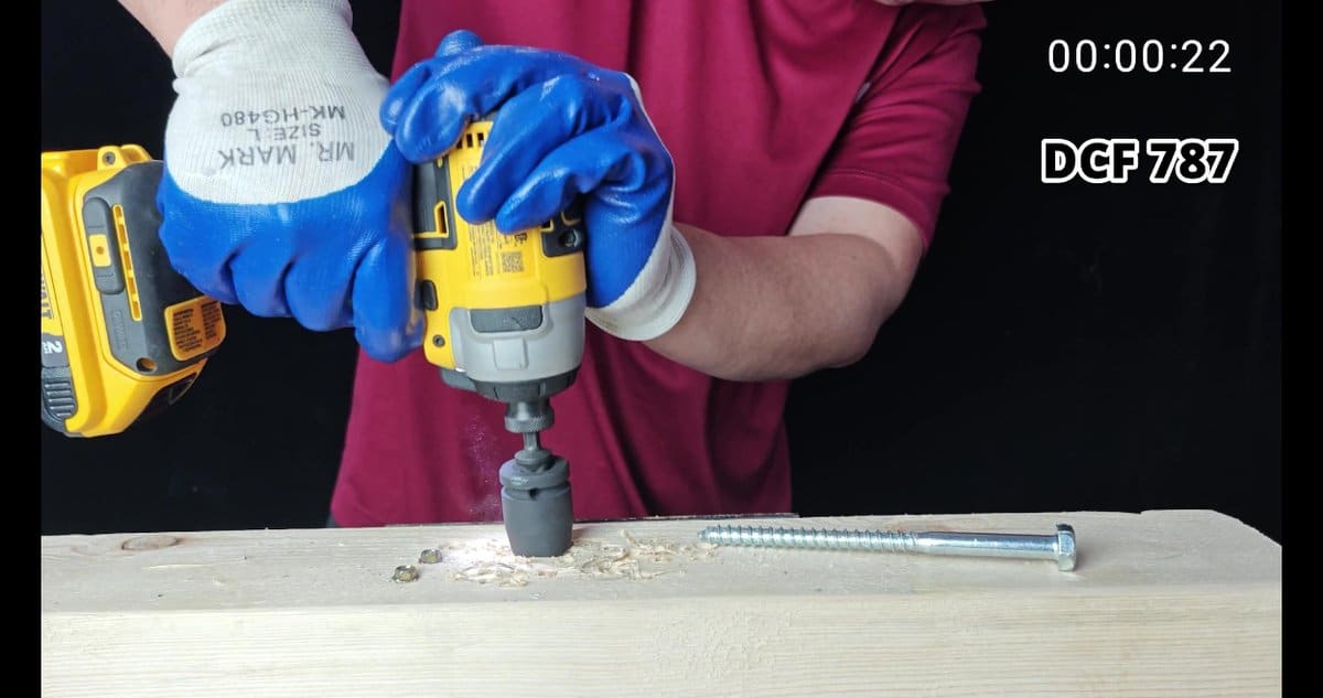 DeWalt drill boring hole in wooden plank