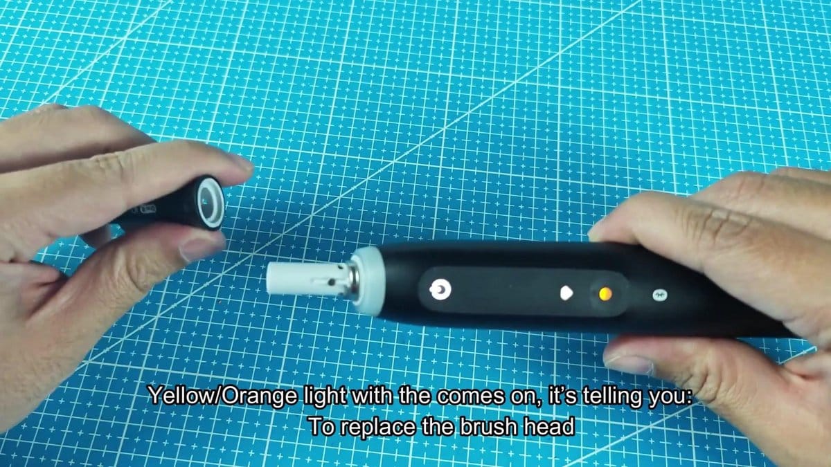 Electric toothbrush with orange light indicator