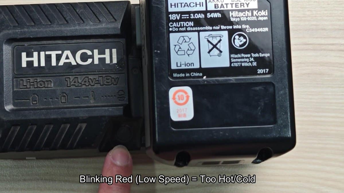 Hitachi battery with caution label visible