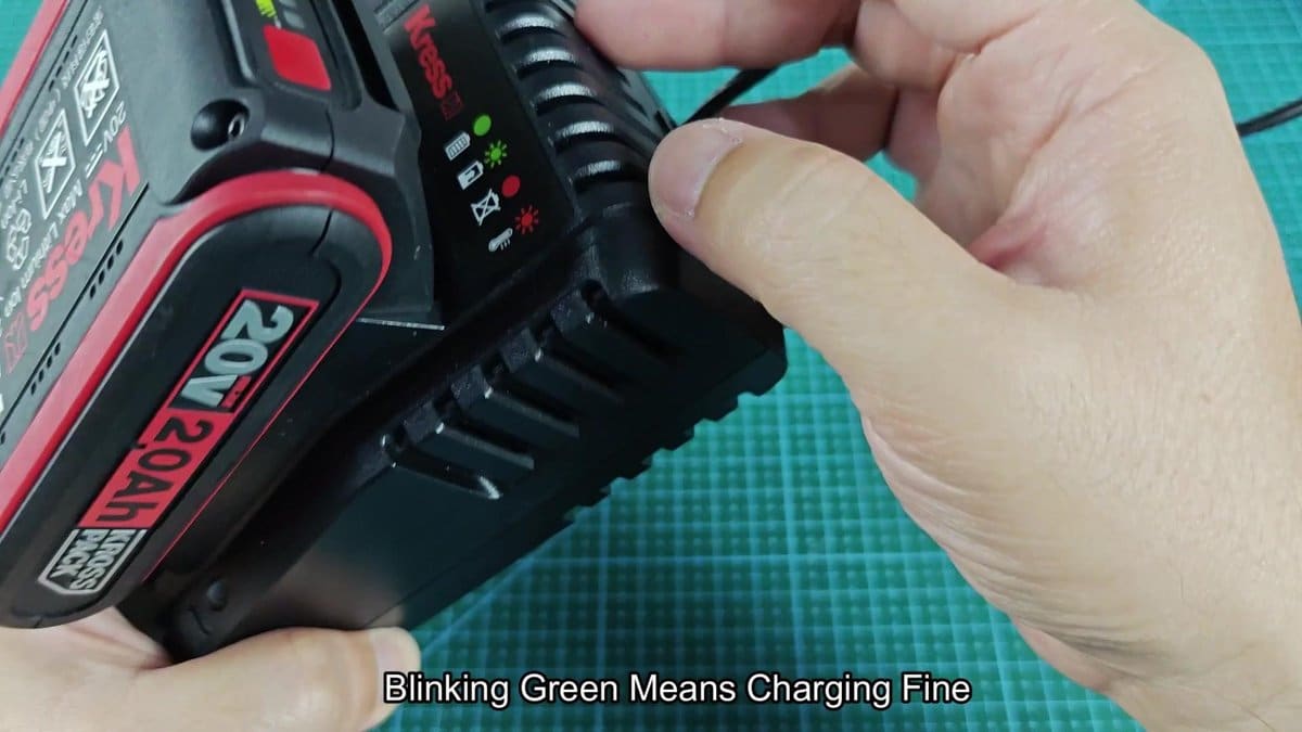 Kress 20V battery on charger with green light blinking