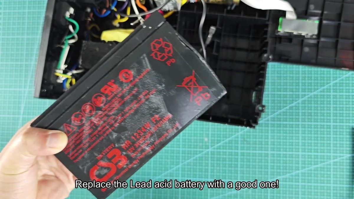 Lead acid battery with recycling symbols visible