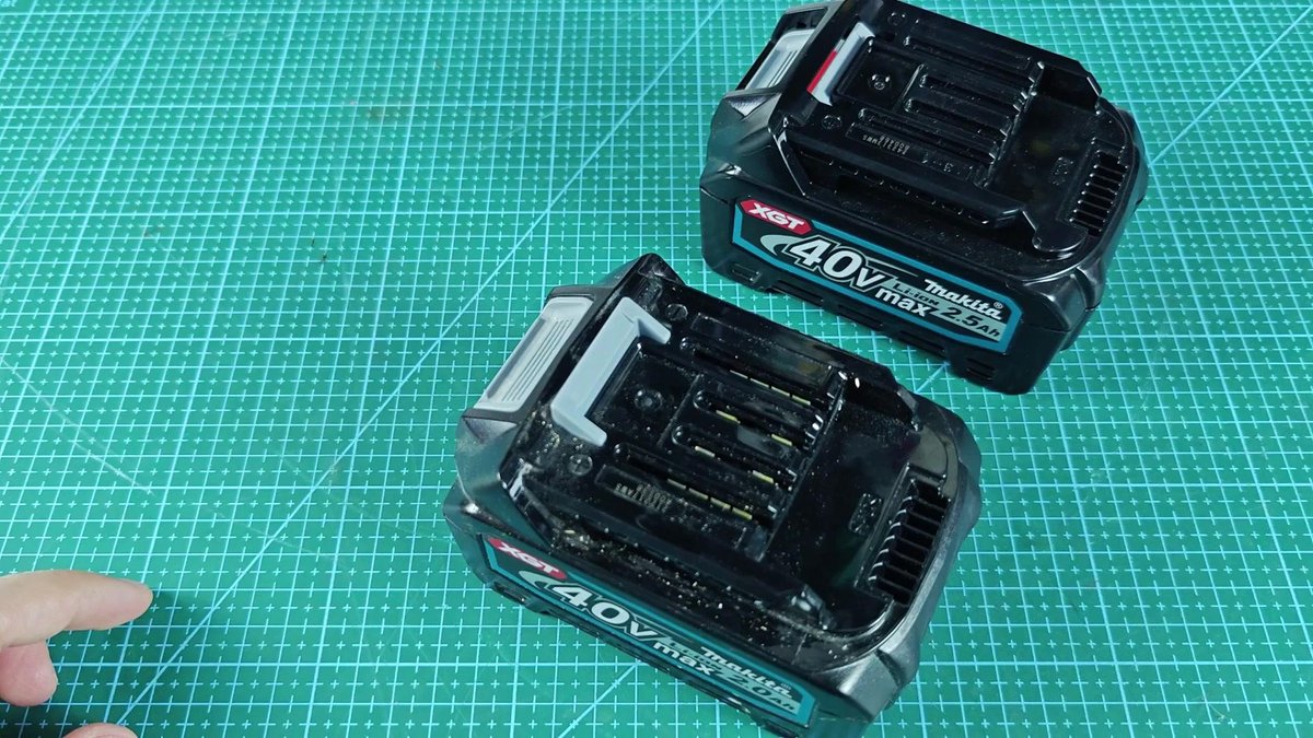 Makita 40V max 2.5Ah battery packs on cutting mat