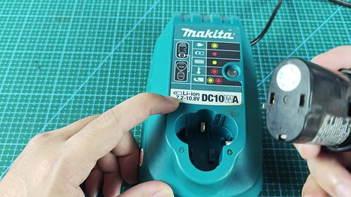 Makita DC10WA charger on green mat