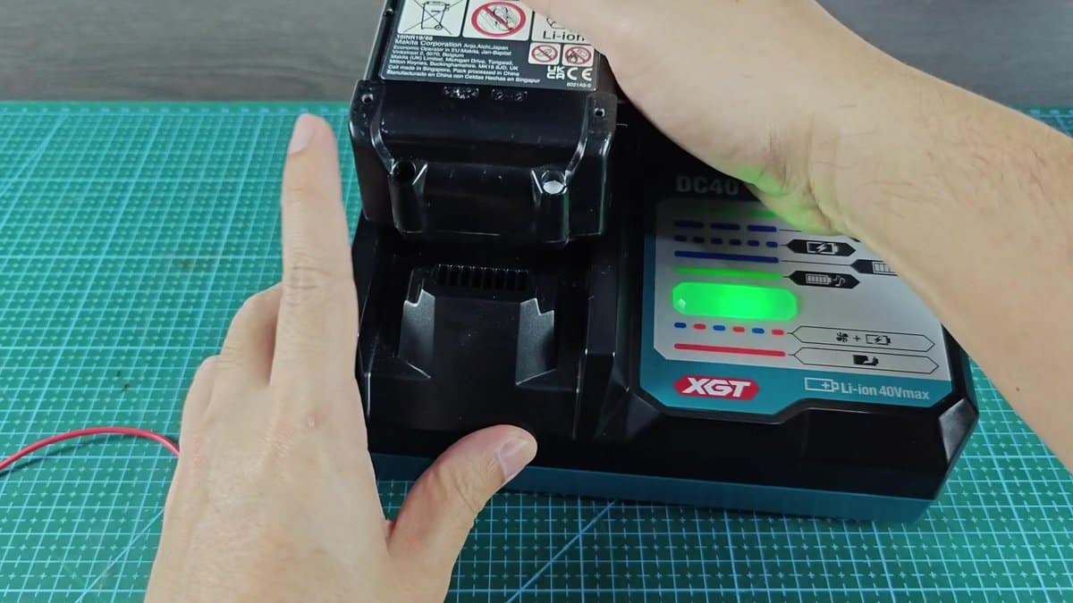 Makita XGT battery on charger with green light