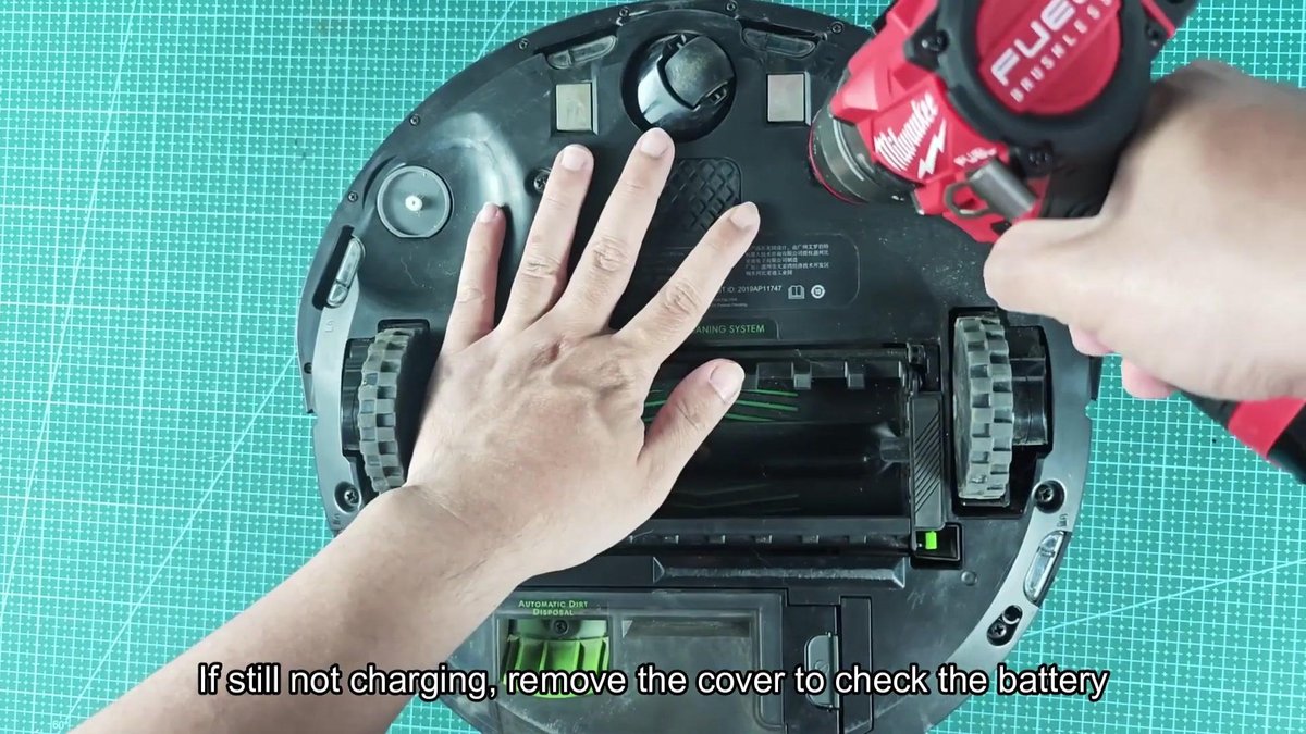 Milwaukee drill removing cover from robot vacuum