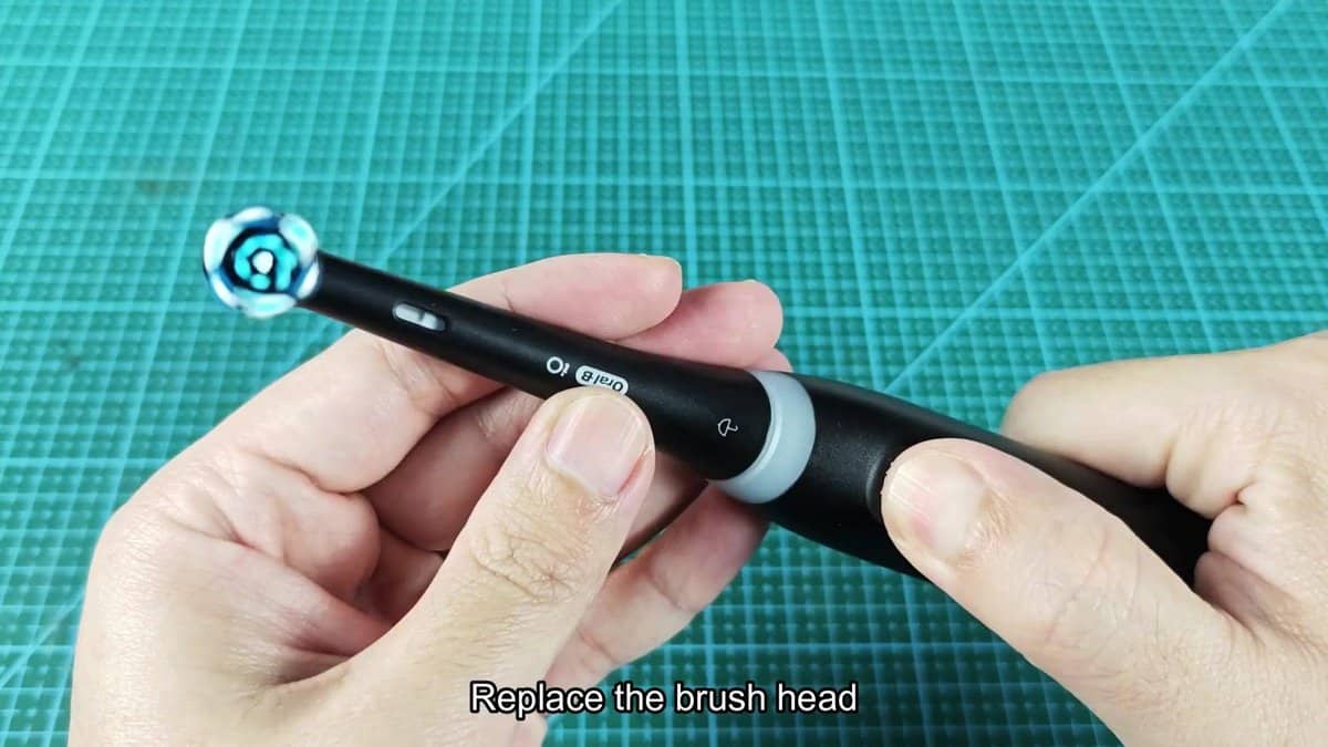 Oral-B electric toothbrush on cutting mat