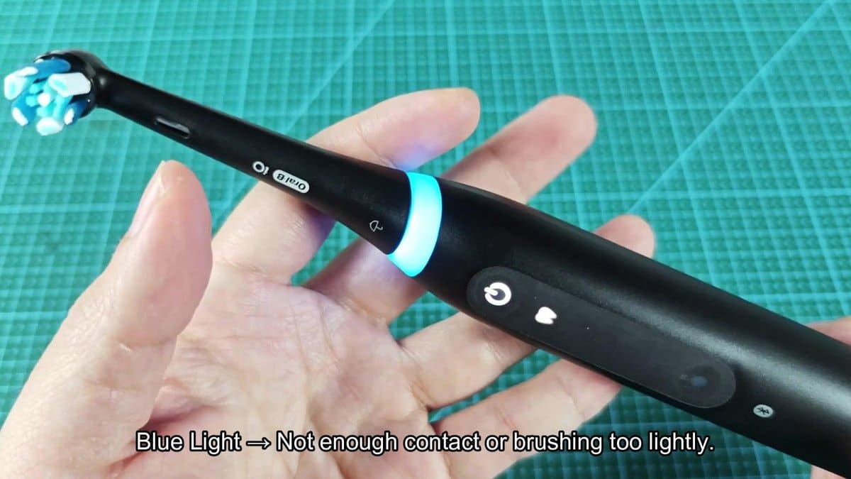 Oral-B electric toothbrush with blue light indicator
