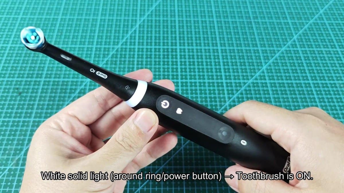 Oral-B electric toothbrush with white ring light on