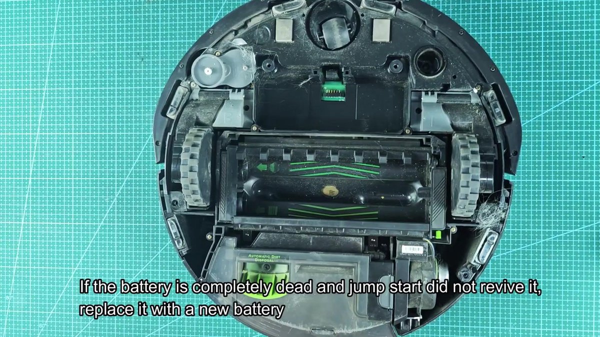 Robot vacuum underside showing roller brushes