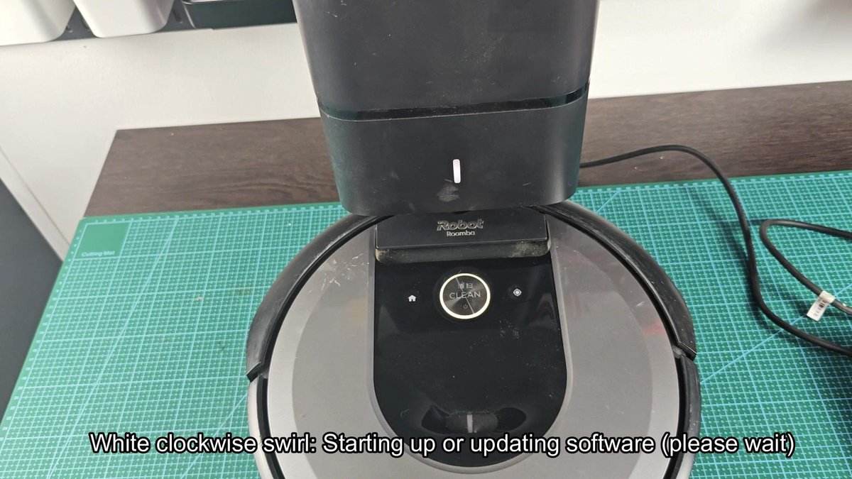 Roomba docked with white light indicator