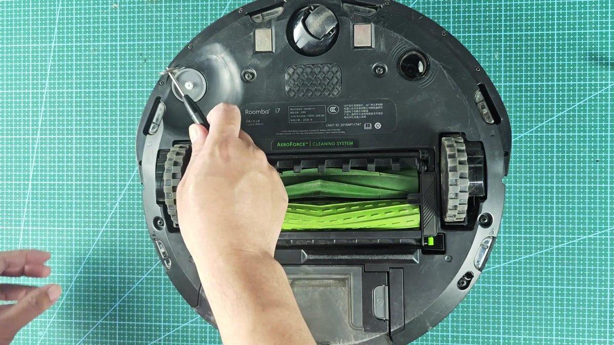 Roomba i7 on cutting mat with tool adjustment