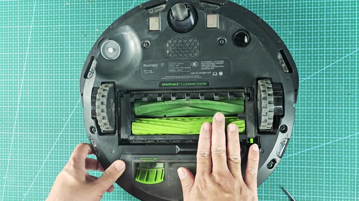 Roomba i7 with open cleaning brush compartment