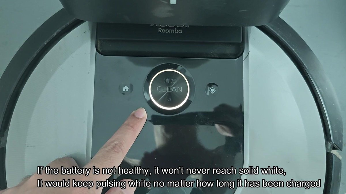 Roomba vacuum with clean button illuminated