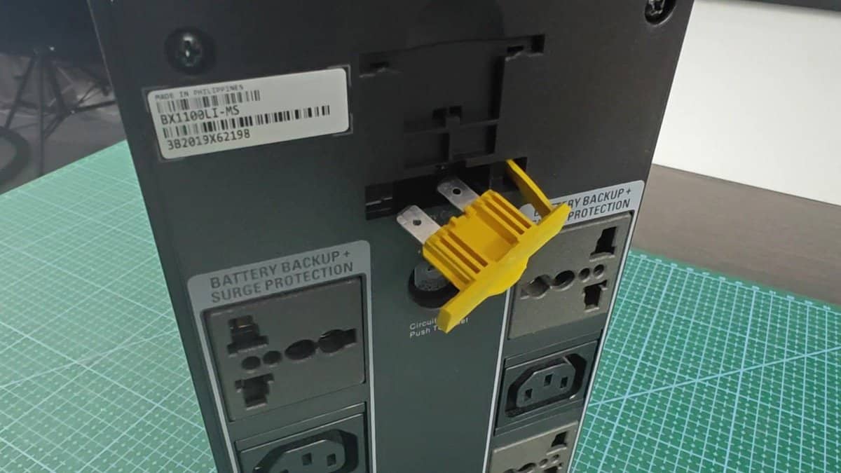 UPS with yellow plastic cover on battery slot