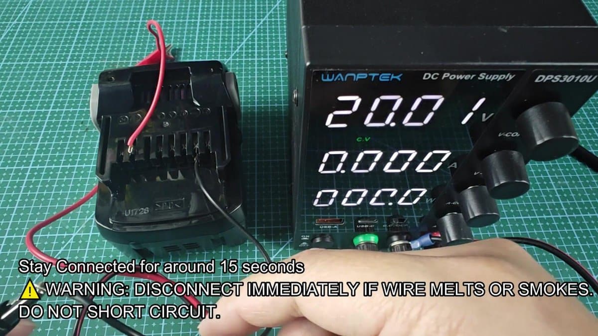 Wantek DC power supply connected to battery adapter