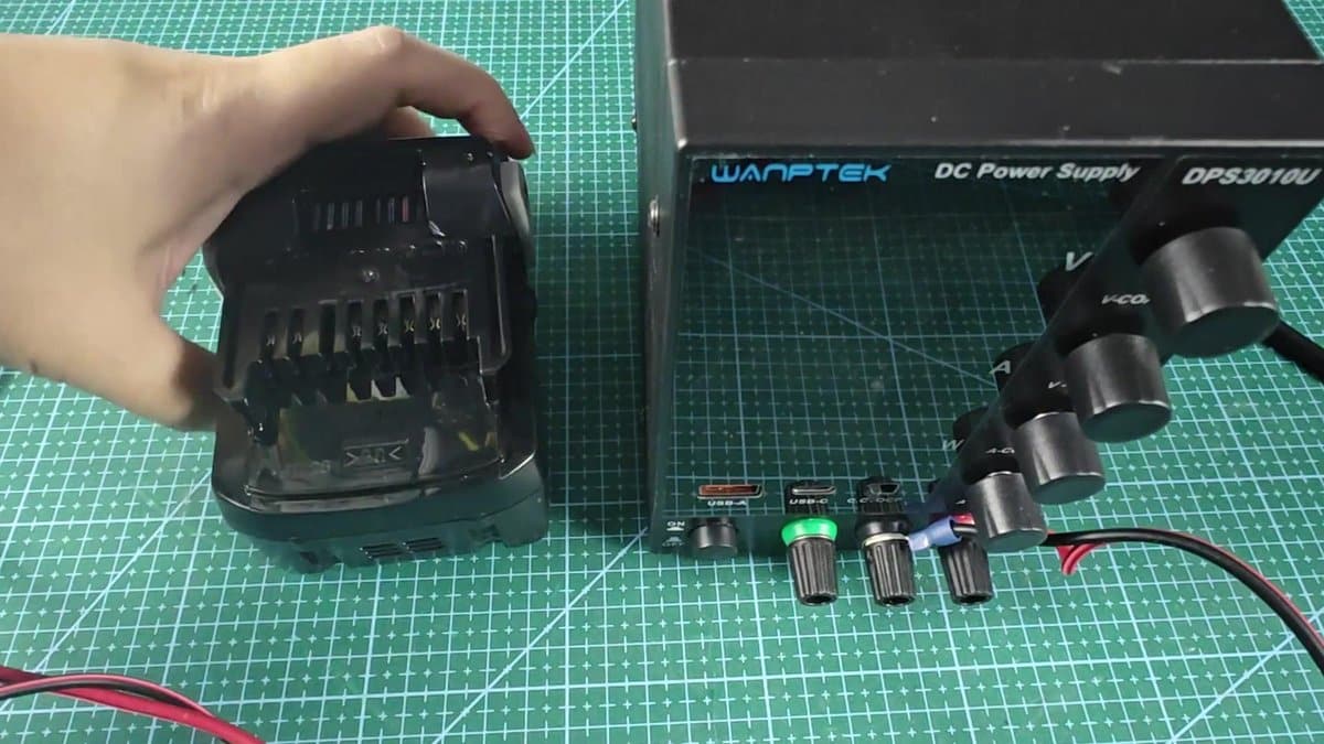 WEP DC power supply next to black charger