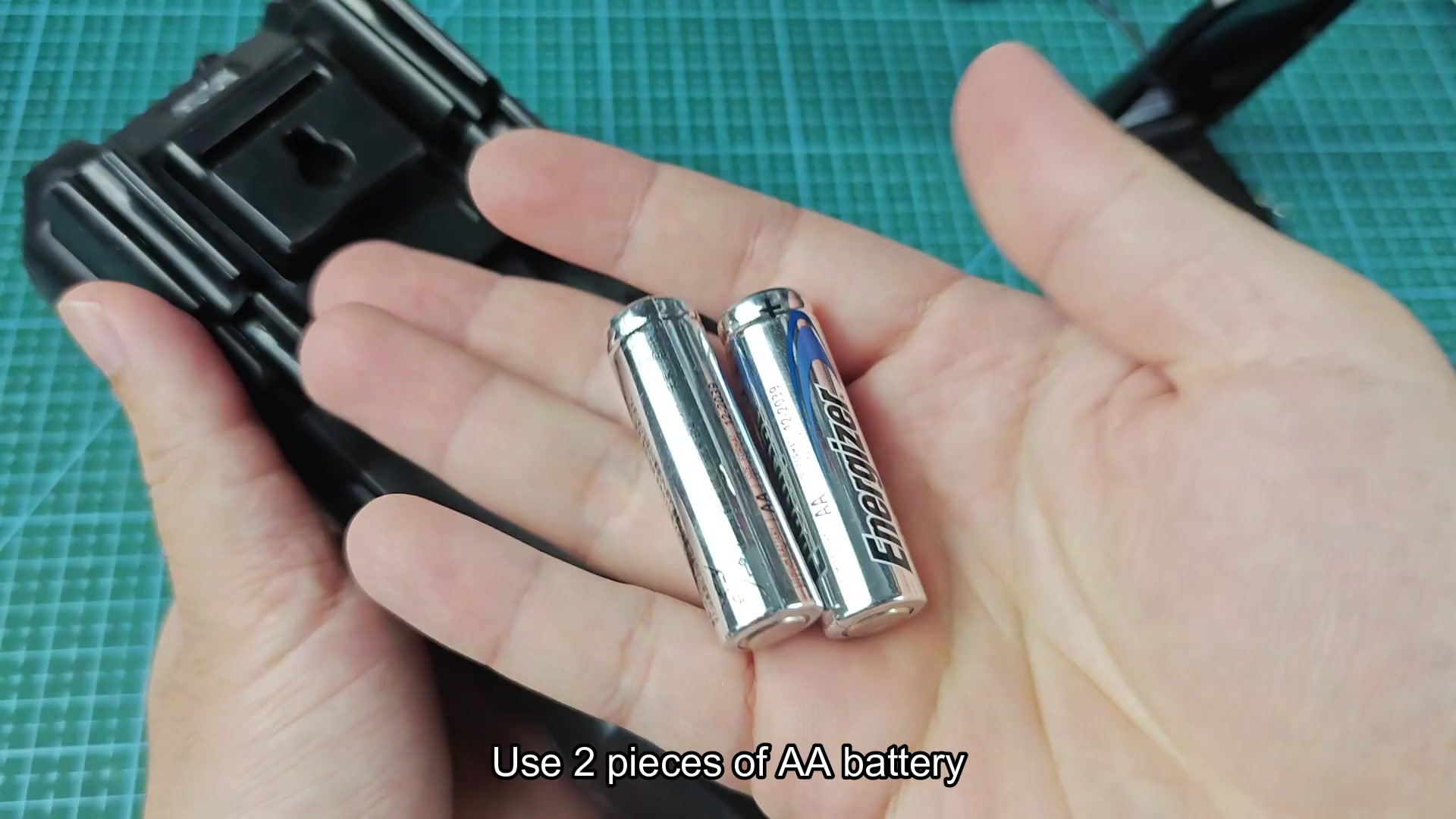 Battery compartment open with AA slots visible