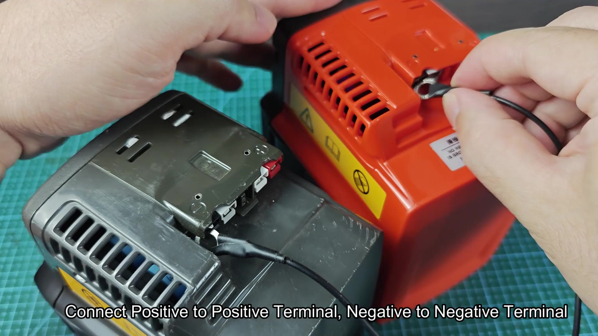 Black wire ring terminal connecting to battery