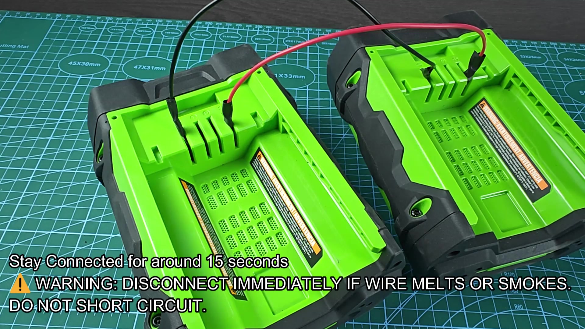 Chargers wired together with warning