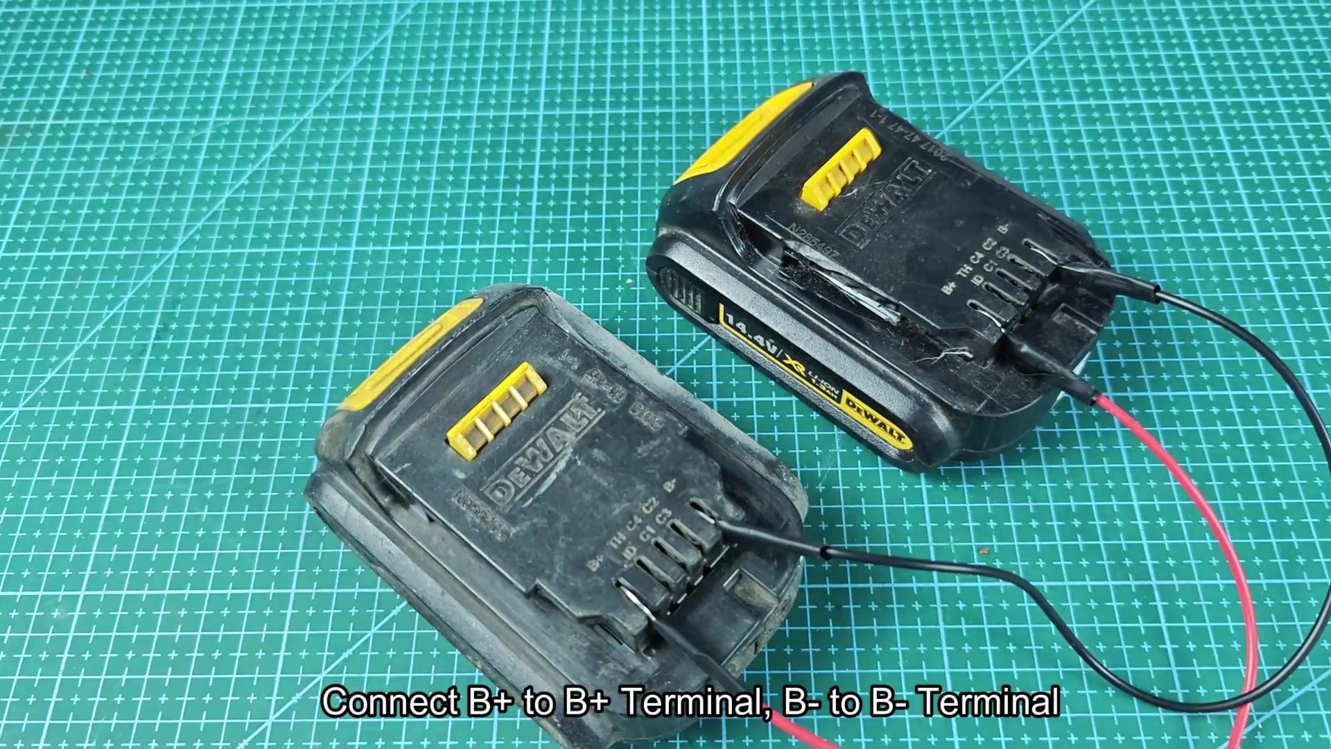 DEWALT batteries linked by red and black wires DEWALT batteries linked by red and black wires