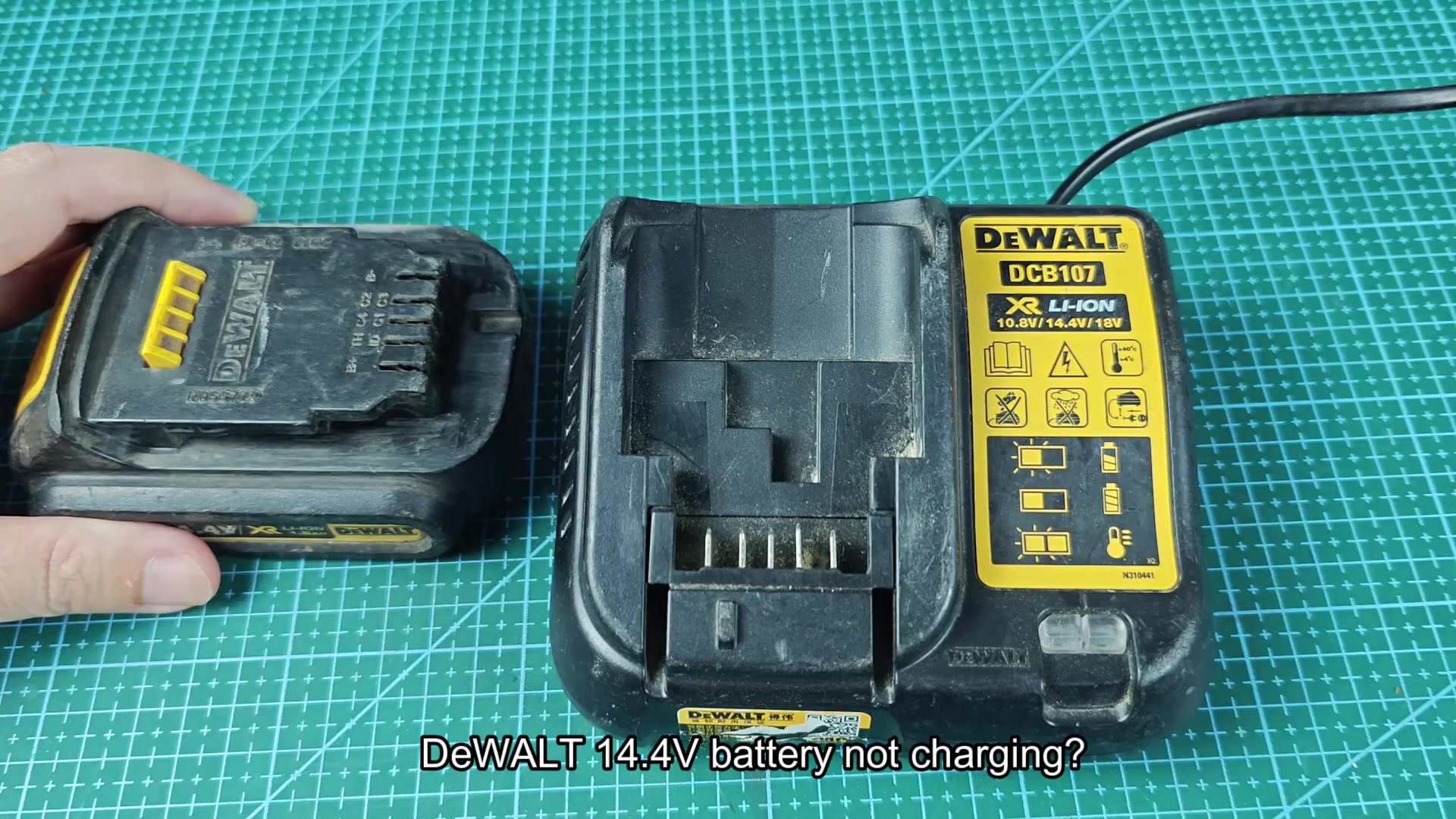 DEWALT DCB107 charger beside 14.4V battery pack DEWALT DCB107 charger beside 14.4V battery pack