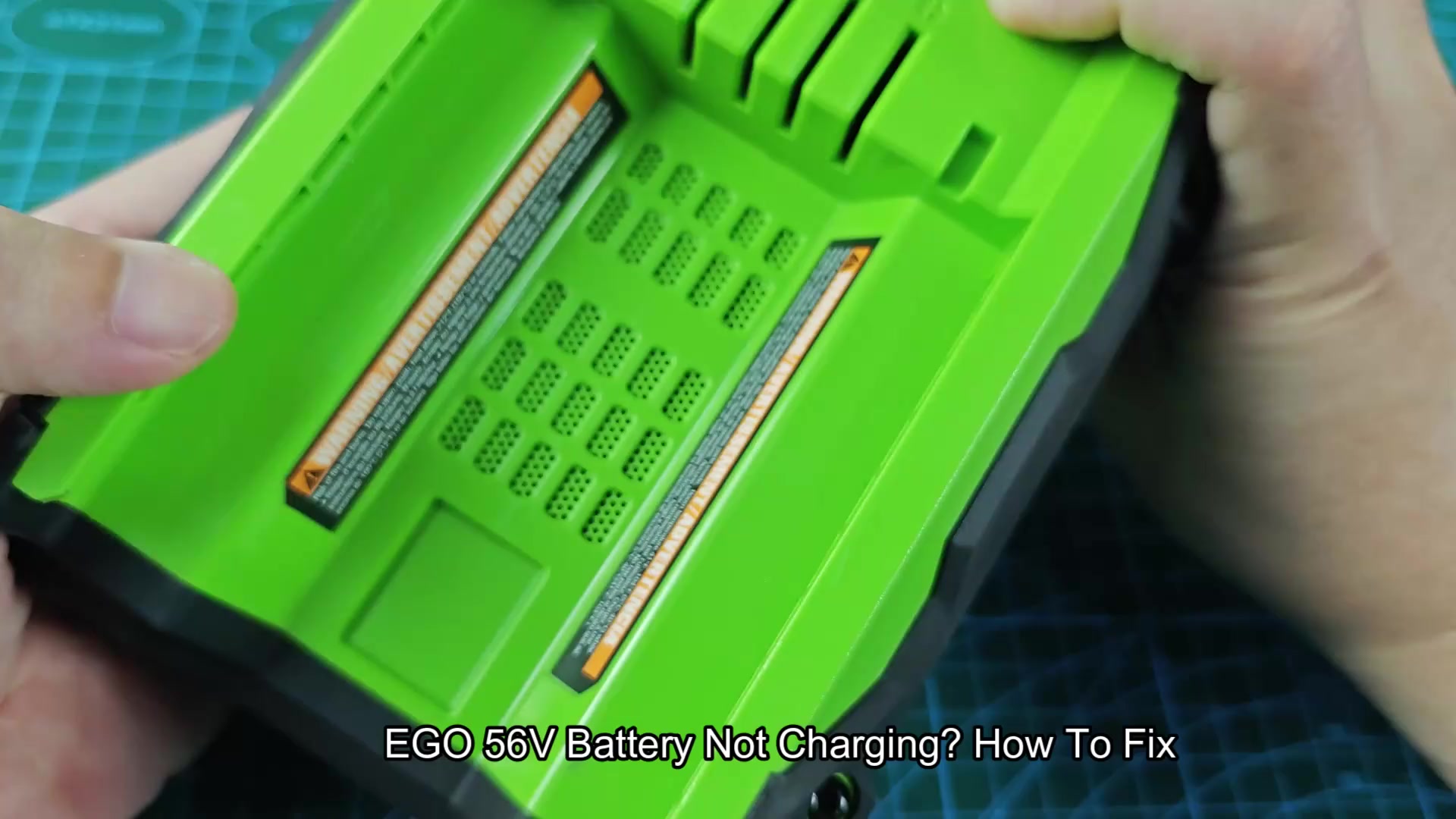 EGO battery resting on blue mat