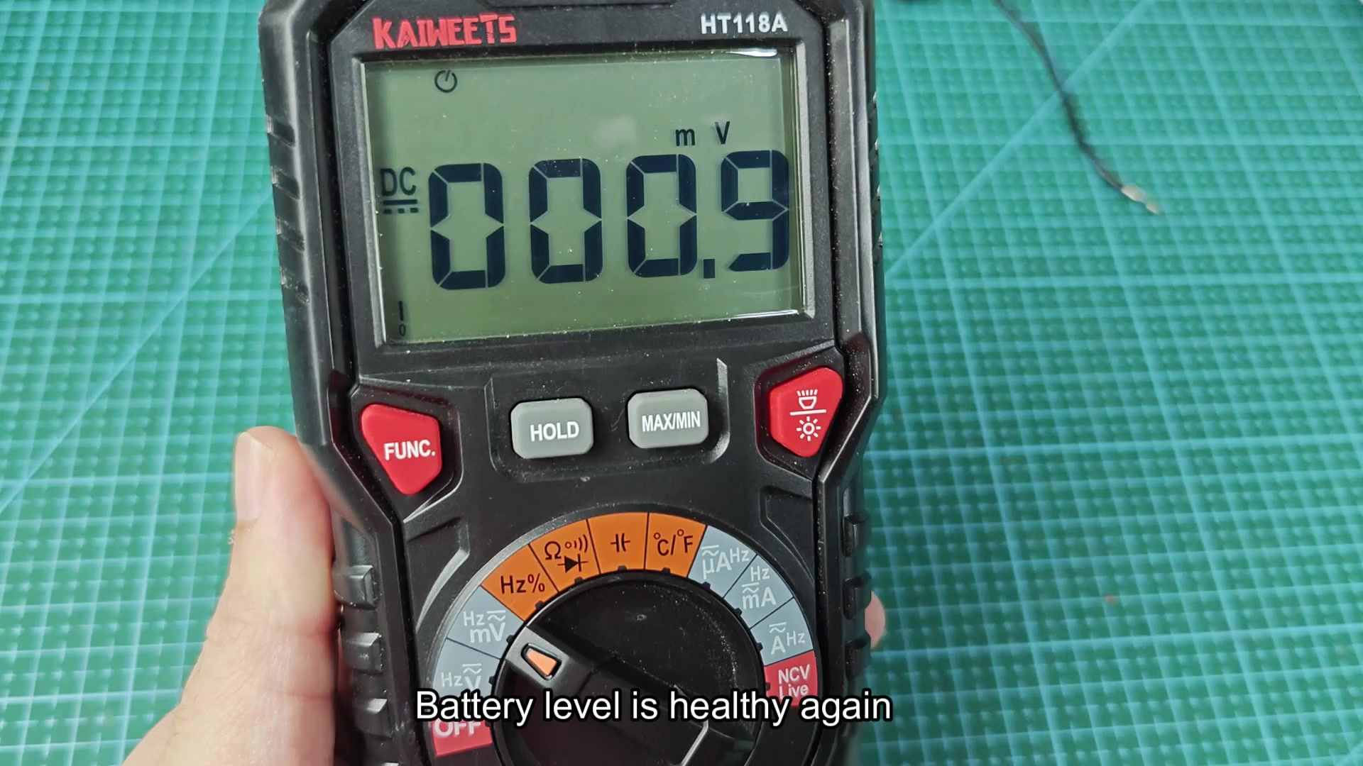 HT118A multimeter displaying 000.2 mV reading